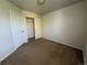 A simple bedroom with a closet and neutral carpet at 20558 E Grand Ln, Aurora, CO 80015