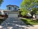 Charming two-story home with a two car garage and landscaped front yard at 20558 E Grand Ln, Aurora, CO 80015