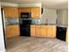 Spacious kitchen featuring stone countertops, stainless appliances, and tile flooring at 20558 E Grand Ln, Aurora, CO 80015