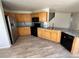 Kitchen featuring stone countertops, stainless steel appliances, and tile flooring at 20558 E Grand Ln, Aurora, CO 80015