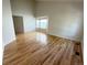 Bright living room featuring gleaming hardwood floors and a bay window at 20558 E Grand Ln, Aurora, CO 80015