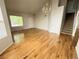 Spacious living area with gleaming hardwood floors, staircase and bright natural light at 20558 E Grand Ln, Aurora, CO 80015