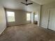 Spacious main bedroom with lots of natural light and a ceiling fan at 20558 E Grand Ln, Aurora, CO 80015