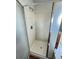Shower stall featuring tiled walls, shower head, and glass doors at 20558 E Grand Ln, Aurora, CO 80015