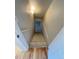 Stairwell with wood stairs that leads to the lower level with hardwood flooring at the top at 20558 E Grand Ln, Aurora, CO 80015