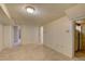 Open basement with tile flooring, white walls and ceiling, plus lighting at 4514 Bryant St, Denver, CO 80211