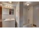 Clean bathroom features white subway tile shower/tub and vanity at 4514 Bryant St, Denver, CO 80211