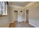 Bedroom showcasing hardwood floors, closet, and two doors at 4514 Bryant St, Denver, CO 80211