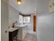 Functional laundry room with washer, dryer, and utility sink at 4514 Bryant St, Denver, CO 80211