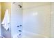 Bright white bathroom showcasing white subway tiles, bathtub and shower combination at 2684 S Logan St, Denver, CO 80210