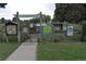 Entrance to the community garden with a sign that reads: Rosedale Community Garden, and informational boards at 2684 S Logan St, Denver, CO 80210