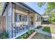 Exterior view of home showcasing cozy front porch with seating and curb appeal at 2684 S Logan St, Denver, CO 80210