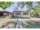 Charming home with a well-manicured lawn, inviting walkway, and a welcoming facade at 2684 S Logan St, Denver, CO 80210
