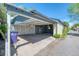 View of the garage with an open carport featuring storage inside at 2684 S Logan St, Denver, CO 80210