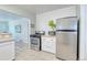 A modern kitchen with stainless steel appliances including a refrigerator and oven at 2684 S Logan St, Denver, CO 80210