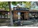 Exterior view of Lil Coffee Shop, featuring string lights and a charming brick facade at 2684 S Logan St, Denver, CO 80210