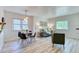 Bright, airy living room featuring hardwood floors, neutral walls, and a cozy seating area at 2684 S Logan St, Denver, CO 80210
