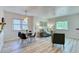 Bright, airy living room featuring hardwood floors, neutral walls, and a cozy seating area at 2684 S Logan St, Denver, CO 80210
