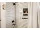 Modern bathroom shower featuring sleek black hardware and subway tile, offering a spa-like experience at 7256 S Broadway, Centennial, CO 80122