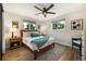 Bright bedroom with neutral tones, a comfortable bed, and stylish decor, offering a relaxing retreat at 7256 S Broadway, Centennial, CO 80122