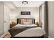 Cozy bedroom with neutral tones, comfortable bed, and soft lighting at 7256 S Broadway, Centennial, CO 80122