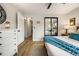 Spacious bedroom with ample closet space and neutral decor, providing a serene and organized atmosphere at 7256 S Broadway, Centennial, CO 80122