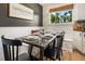 Bright dining room with seating for six and lots of natural light, great for entertaining at 7256 S Broadway, Centennial, CO 80122