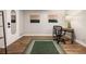 Bright office space featuring light hardwood floors, minimalist decor, and stylish desk and chair at 7256 S Broadway, Centennial, CO 80122