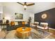 Cozy living room with modern furniture, stylish decor, and a ceiling fan at 7256 S Broadway, Centennial, CO 80122