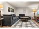 Spacious living room with comfortable seating, plush rug, and stylish decor at 7256 S Broadway, Centennial, CO 80122