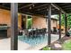 Charming outdoor patio area with dining table and grill, perfect for entertaining guests in the backyard at 7256 S Broadway, Centennial, CO 80122