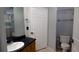 Bathroom featuring granite counters, vanity, toilet, and shower with tub and shower curtain at 8400 S Upham Way # E4, Littleton, CO 80128