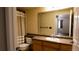 Bathroom featuring a shower/tub combo, a large mirror, and a vanity with a sink at 8400 S Upham Way # E4, Littleton, CO 80128