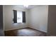 Cozy bedroom with neutral walls, carpeted floor, and a window with curtains at 8400 S Upham Way # E4, Littleton, CO 80128