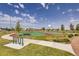 Community basketball court in a neighborhood park with trees and walking paths at 139 N Prairie Falcon Pkwy, Brighton, CO 80601