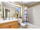 Cozy bathroom boasts a shower-tub combo and vanity sink with decor at 139 N Prairie Falcon Pkwy, Brighton, CO 80601