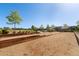 A bocce ball court in a common area with benches and trees, offering relaxation and recreation at 139 N Prairie Falcon Pkwy, Brighton, CO 80601