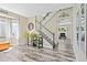 Welcoming entryway with staircase, stylish decor, and seamless transition to the living spaces at 139 N Prairie Falcon Pkwy, Brighton, CO 80601