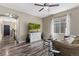 Comfortable living room with large windows, stylish furnishings, and direct access to the entryway at 139 N Prairie Falcon Pkwy, Brighton, CO 80601
