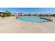 This community pool has multiple lanes, lounge chairs, and covered seating areas at 139 N Prairie Falcon Pkwy, Brighton, CO 80601