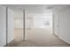 Bright, unfinished basement space with neutral carpet and white walls awaiting personalization at 22935 E River Chase Way, Parker, CO 80138