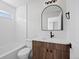 Contemporary bathroom with sleek vanity, modern fixtures, and tiled bathtub at 22935 E River Chase Way, Parker, CO 80138