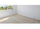 Bright bedroom with a large window and neutral carpet at 22935 E River Chase Way, Parker, CO 80138