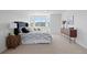 Bedroom features neutral carpet, a ceiling fan and a window overlooking greenery at 22935 E River Chase Way, Parker, CO 80138