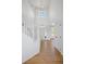 Elegant foyer with high ceilings, hardwood floors, a modern light fixture, and a staircase at 22935 E River Chase Way, Parker, CO 80138