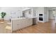 Bright kitchen features an island, stainless steel appliances, and plenty of storage at 22935 E River Chase Way, Parker, CO 80138