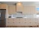 Modern kitchen boasts stainless steel refrigerator and a clean, minimalist aesthetic at 22935 E River Chase Way, Parker, CO 80138