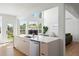 Modern kitchen includes eat-in island, stainless appliances, and a seamless design at 22935 E River Chase Way, Parker, CO 80138