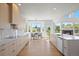 Bright and airy kitchen with sleek cabinets and views of the green backyard at 22935 E River Chase Way, Parker, CO 80138