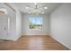Sunlit living room, showcasing hardwood floors and a large window offering neighborhood views at 22935 E River Chase Way, Parker, CO 80138